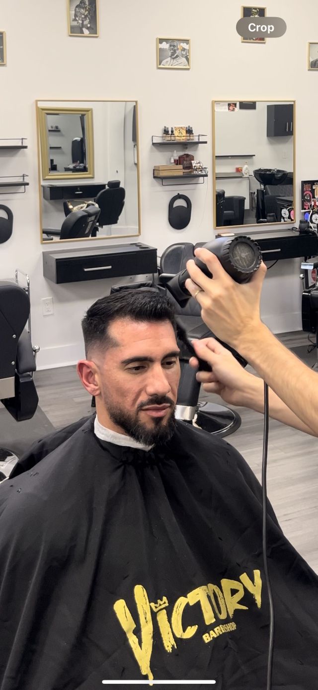 Taper fade haircut by Dimitri Popazoglo at Victory Barbershop in Boca Raton